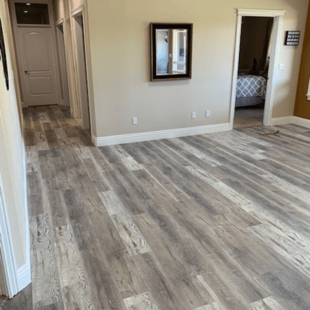 Contemporary grey laminate flooring installed in a residential living room