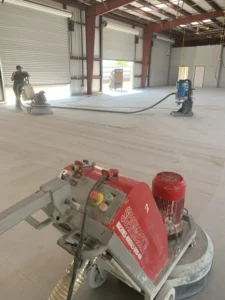 Commercial concrete floor being sanded and polished for a large garage or warehouse space