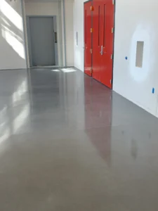 High-gloss polished concrete floor installed in a hallway of a school building
