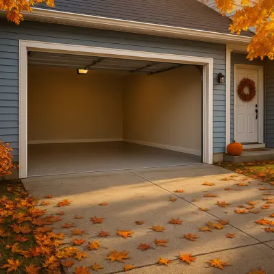 Cozy fall garage with light flake epoxy flooring, blue home exterior, and fallen oak leaves — Redding, Northern California.