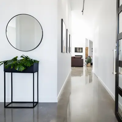 Contemporary home entry with polished concrete floors