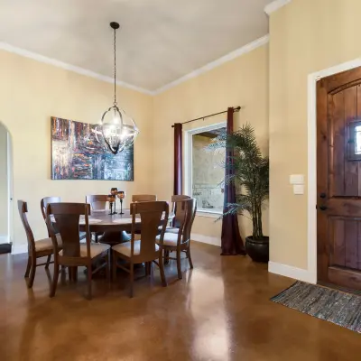 Warm Dining room with stained concrete flooring